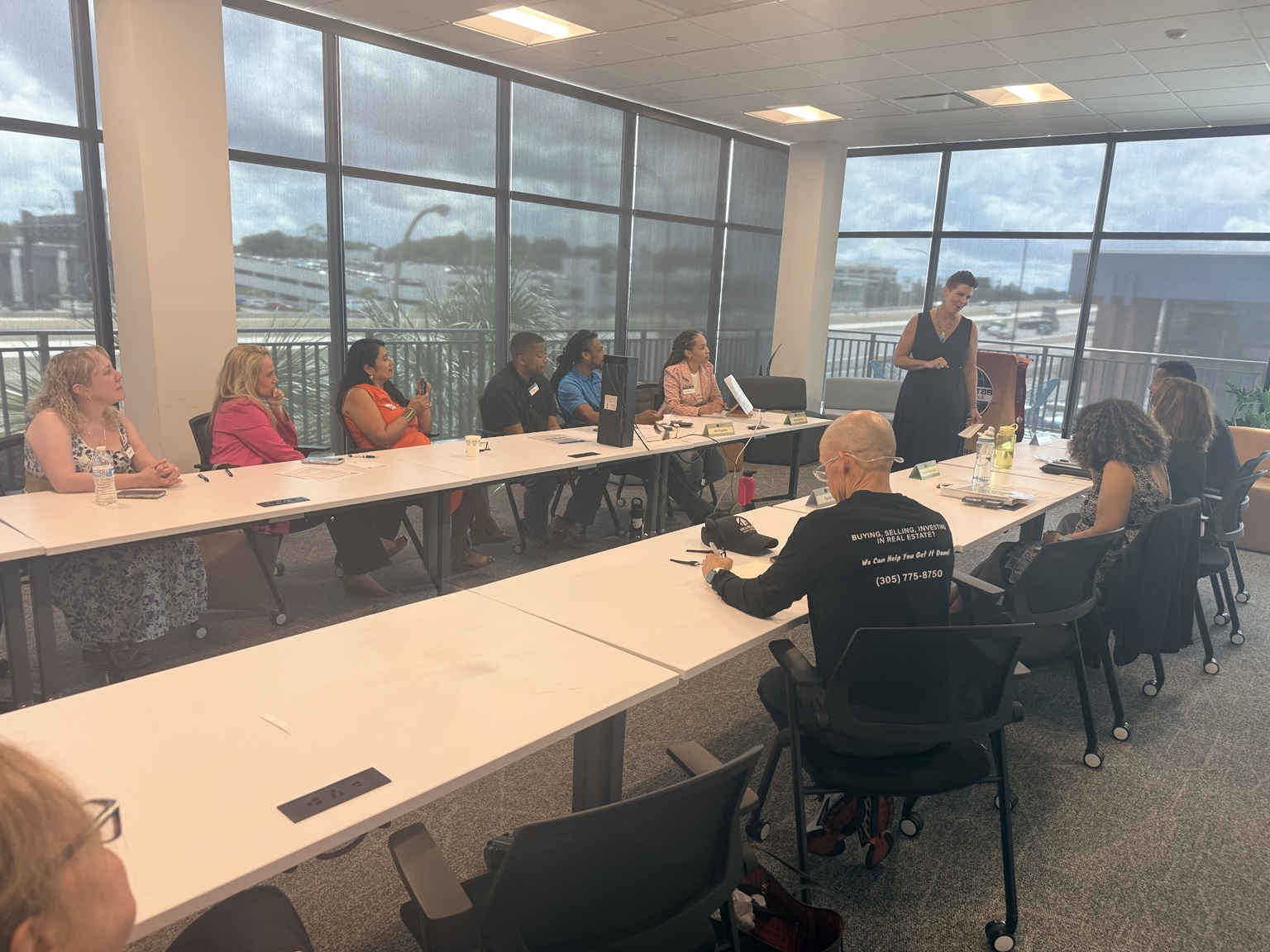 Kristi Nowrouzi leading a group discussion during a workshop